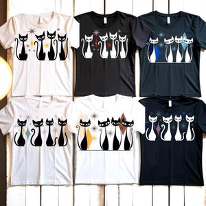 May include: A collection of six t-shirts featuring a retro design of stylized black cats. The shirts come in various colors, including white, black, and navy, with the cat graphics and geometric shapes in contrasting colors. The shirts are made of a soft material.