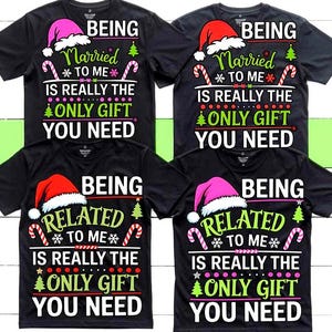 May include: Black t-shirts with Christmas-themed text. The shirts feature Santa hats, candy canes, and the phrases "Being Married To Me Is Really The Only Gift You Need" and "Being Related To Me Is Really The Only Gift You Need."