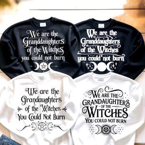 May include: Four sweatshirts, two black and two white, with the text "We are the Granddaughters of the Witches you could not burn." The design includes crescent moons, stars, and a pentagram.