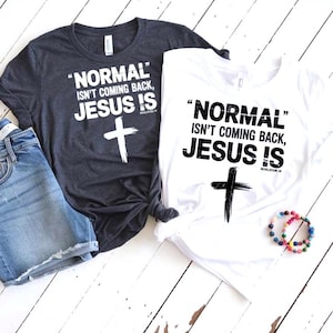 May include: Two t-shirts, one dark gray and one white, with the text "NORMAL isn't coming back, JESUS IS" and a cross graphic. The dark gray shirt is paired with denim shorts. A beaded bracelet is also visible.
