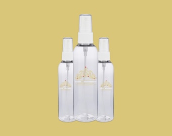 May include: Three clear plastic spray bottles with white tops and a gold crown logo. The bottles are empty and ready to be filled with your favorite liquids.