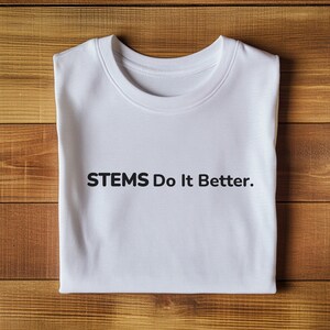 May include: White t-shirt with the text "STEMS Do It Better." printed in black.