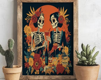 May include: A framed art print featuring two stylized skeletons toasting with wine glasses. The skeletons are adorned with floral headpieces and surrounded by colorful flowers. The background includes an orange sun and dark blue tones.