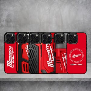 May include: A collection of six smartphone cases featuring red and black designs with the text Mymastree and M12 FUEL. The cases display various patterns including solid red, perforated black textures, and tool-inspired graphics with white lettering.