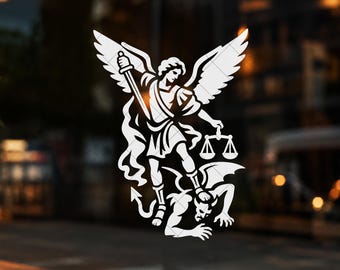 May include: A white vinyl decal featuring a detailed illustration of Saint Michael the Archangel with wings spread, holding a sword in one hand and a set of scales in the other, while standing over a horned figure with a tail on the ground.