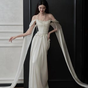Off-Shoulder Chiffon Minimalistic Wedding Dress – Draped Greek Goddess Bridal Gown with Flowing Sleeves and Train - MOONIE