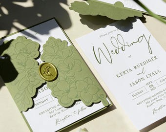 May include: Wedding invitation suite featuring a green floral design. The invitation includes the names Kerta Ruediger and Jason Lyall, with the date September 8, 2025. A gold wax seal and floral cutouts add elegance.
