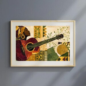 Puede incluir: Impresión artística enmarcada que representa a una mujer tocando la guitarra. La guitarra es de color rojo oscuro, y la mujer lleva un pañuelo amarillo y pendientes de aro dorados. El fondo presenta un collage de formas geométricas en verde, amarillo y dorado.