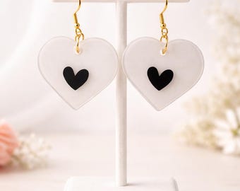 Heart shaped white and black resin earrings