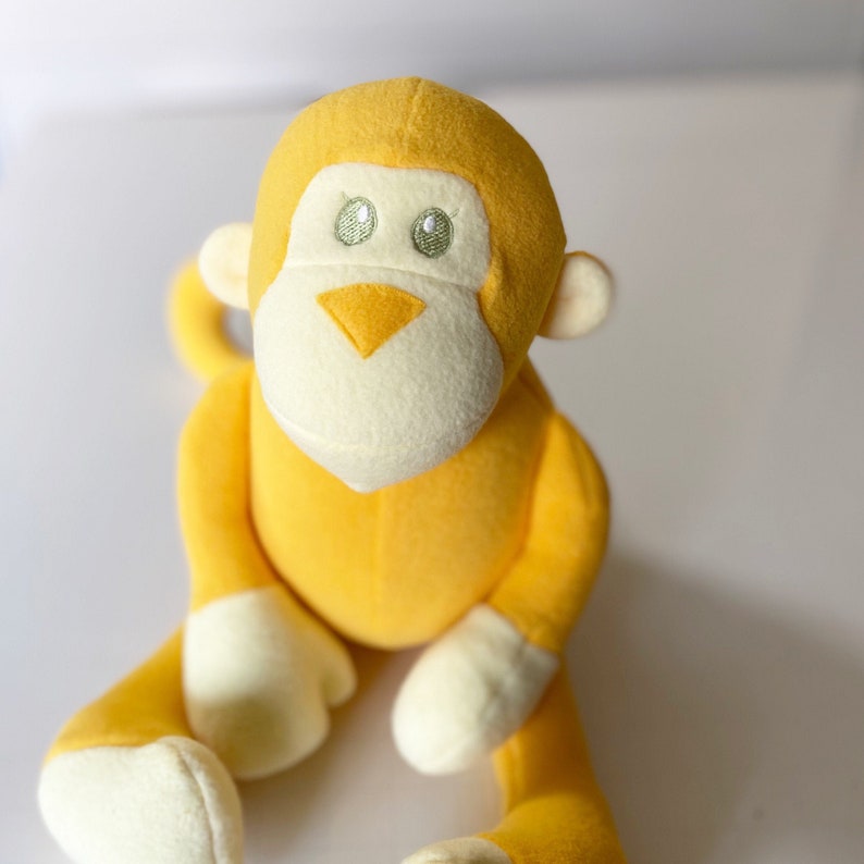 black and yellow stuffed monkey