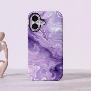 May include: A rectangular smartphone case featuring a swirling marble pattern in shades of light purple, lavender, and deep violet. The case has a dedicated cutout for a dual-lens camera system located in the upper left corner of the back panel.