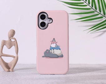 May include: A light pink phone case featuring a cartoon illustration of a large, gray creature with smaller blue and white creatures stacked on top. The phone case has a dual-lens camera cutout.