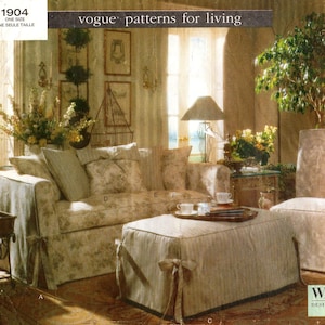 May include: A living room scene featuring a floral-patterned sofa, ottoman, and chair. The room is decorated with plants, framed artwork, and a decorative birdcage. The text "vogue patterns for living" is visible.