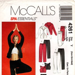 May include: Sewing pattern for a yoga outfit, including trousers, a top, a jacket, a skirt, and a bra. The pattern is for sizes X-Small, Small, and Medium. The pattern is from McCall's SPA Essentials.