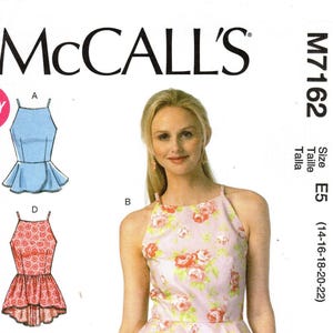 May include: McCall's sewing pattern M7162 featuring three top designs. The pattern includes a halter top with a floral print, a peplum top, and a top with a gathered waist. Size E5 (14-16-18-20-22).