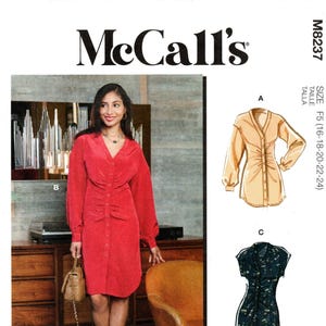 May include: McCall's sewing pattern M8237, featuring a red dress, a tan blouse, and a dark floral dress design. The pattern includes multiple view options with simple instructions. Designed and printed in the USA.