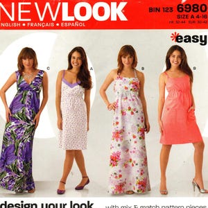 May include: A sewing pattern featuring four women's dresses in various styles and floral prints. The pattern includes a maxi dress with a purple floral print, a white dress with purple polka dots, and a pink dress with a floral pattern. The text "NEWLOOK" is at the top.