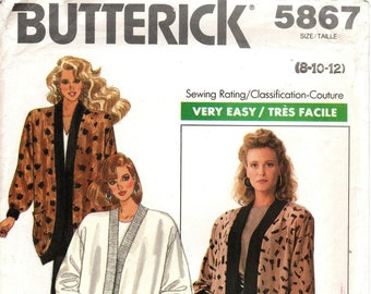 May include: A sewing pattern for a long, open-front jacket with a black trim. The pattern is for sizes 8-10-12 and is rated as very easy to sew. The pattern is from Butterick and has the number 5867.