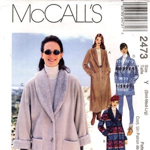 May include: McCall's sewing pattern featuring coat designs. The pattern includes options for a long, light-colored coat with a shawl collar, a tan coat with a belt, and a patterned coat. The pattern is labeled Petite-Able.