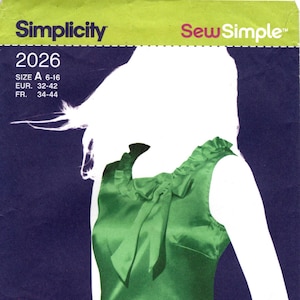 May include: A Simplicity Sew Simple sewing pattern envelope 2026, size A 6-16, featuring a sleeveless green satin top with a ruffled neckline and a tie detail. The dark blue and lime green packaging includes a barcode and the text one easy project.
