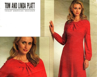 May include: A red dress sewing pattern with a bow at the neckline. The pattern is for sizes 6-8-10-12. The pattern is by Tom and Linda Platt, Vogue American Designer.