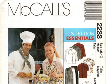 May include: A sewing pattern for a uniform, featuring a chef's hat, a white chef's jacket, black pants, a red apron, and a white shirt with a red and white pattern. The pattern is for sizes 38 and 40. The text on the pattern reads "Uniform Essentials".