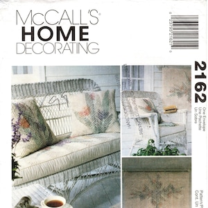 May include: A McCall's Home Decorating pattern for a faux chenille throw pillow or rug. The pattern is for a geometric design with a chevron pattern in shades of brown, beige, and white. The pattern is called "Faux Chenille" by Nannette Holmberg.