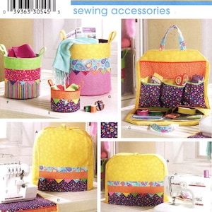 May include: A Simplicity sewing pattern featuring various sewing accessories. The image showcases fabric storage baskets, a sewing kit, and a sewing machine cover. The items are decorated with colorful patterned fabrics.