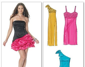 May include: Three different styles of dresses. The first dress is a black and pink strapless dress with a ruffled skirt. The second dress is a yellow one-shoulder dress with a fitted bodice and a flowing skirt. The third dress is a pink strapless dress with a fitted bodice and a ruffled skirt.