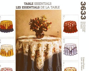 May include: A sewing pattern for table linens, featuring a floral tablecloth, a red and white checkered tablecloth, a blue and white striped tablecloth, and a green and white tablecloth. The pattern includes instructions for making a tablecloth, placemats, and napkins.