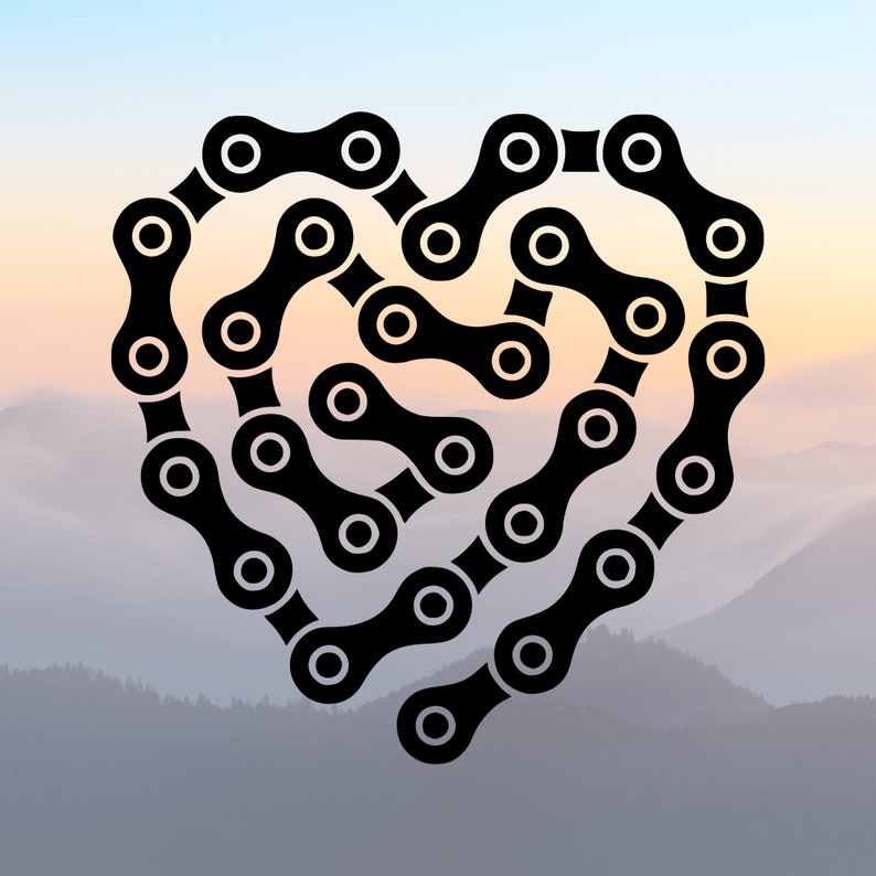 May include: A black bicycle chain arranged in the shape of a heart. The chain is made of metal links and is a common part of a bicycle.