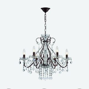 May include: A dark bronze chandelier with six candle-style lights and numerous clear crystal accents. The fixture hangs from a chain and features ornate, curved arms and decorative crystal pendants, creating a classic, elegant look.