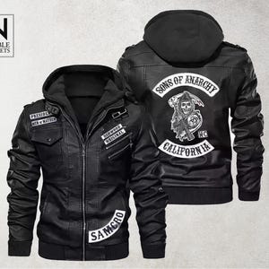 May include: Black leather jacket with a hood and multiple patches. The jacket features the text "PRESIDENT MEN OF MAYHEM", "REDWOOD ORIGINAL", and "SAMCRO". The back of the jacket displays a graphic with the words "SONS OF ANARCHY CALIFORNIA".