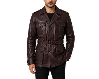 May include: A dark brown leather jacket featuring a collared neckline, shoulder epaulets, and four front flap pockets with button closures. The jacket includes a matching leather belt with a metal buckle at the waist and long sleeves with cuffs.