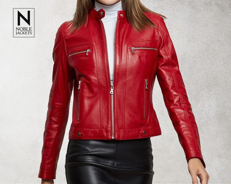 May include: A red leather jacket with a zip fastening and multiple pockets. The jacket has a stand-up collar and a fitted silhouette.