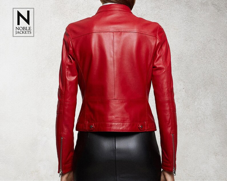 May include: A red leather jacket with a zip fastening and a stand-up collar. The jacket has a slim fit and is made of soft, supple leather.