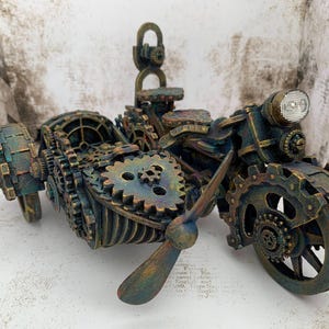May include: A steampunk-style motorcycle with a sidecar, both made of metal and painted in shades of brown, gold, and green. The motorcycle has a headlight and a propeller on the sidecar.