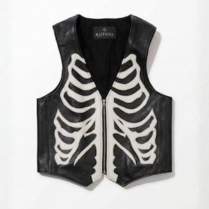 Front view of Raffania skeleton leather vest with white bone applique and YKK zipper closure.