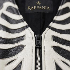 Handmade Raffania skeleton leather vest for men featuring a white ribcage bone design on premium black genuine cowhide leather.
