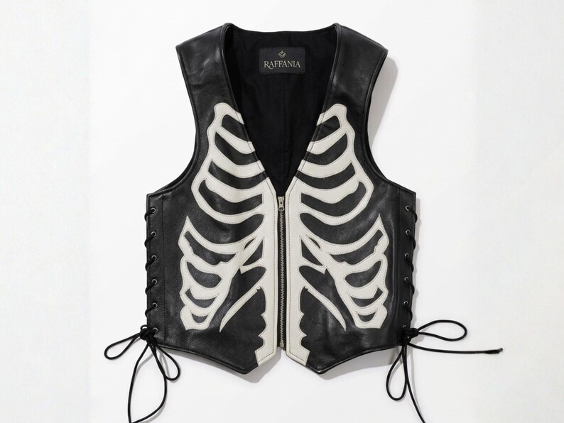Front view of Raffania skeleton leather vest with white bone applique and YKK zipper closure.
