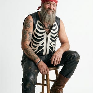 Handmade Raffania skeleton leather vest for men featuring a white ribcage bone design on premium black genuine cowhide leather.