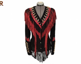 May include: A black jacket featuring long red and black fringe detailing along the shoulders and chest. The garment includes a V-neckline accented with red trim and white quill-like embellishments, with matching quill accents on the sleeves.