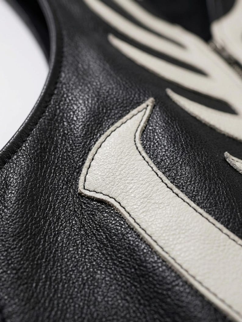 Handmade Raffania skeleton leather vest for men featuring a white ribcage bone design on premium black genuine cowhide leather.