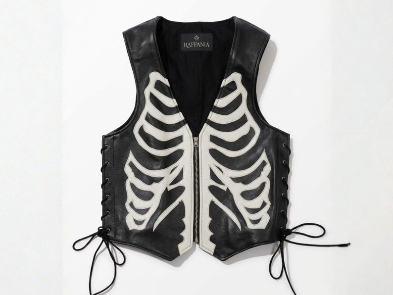 Front view of Raffania skeleton leather vest with white bone applique and YKK zipper closure.