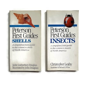 May include: Two Peterson First Guides books, one on shells and one on insects. The shell book features a brown and white seashell on the cover. The insect book features a red ladybug on the cover.