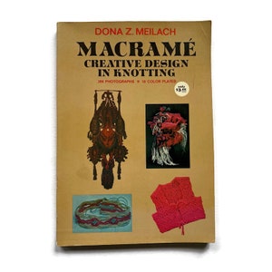 May include: A book titled "Macrame Creative Design in Knotting" by Dona Z. Meilach. The book cover features images of macrame projects, including a hanging wall decor, a belt, and a vest. The book cover is brown with a red and white color scheme.