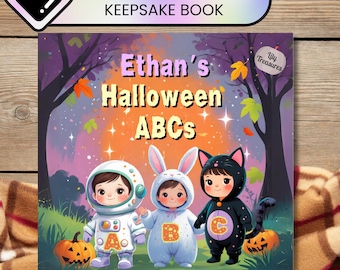 Puede incluir: Un libro de recuerdos de Halloween para niños titulado "Ethan's Halloween ABCs". La portada presenta a tres niños disfrazados: un astronauta, un conejito y un gato. Las calabazas y las hojas de otoño decoran el fondo.