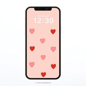 May include: A smartphone with a pink screen displaying a pattern of red and pink hearts. The time is 12:30, and the date is Monday, 10. The phone has a black border and a silver frame. The bottom of the screen has the text "© 2026 KOKONEMURU."