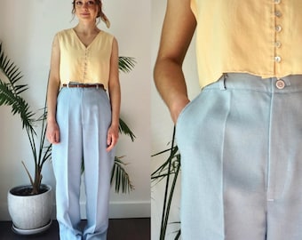 Pantaloni a vita alta. Pantaloni vintage anni '70 da donna, azzurri, a gamba dritta.