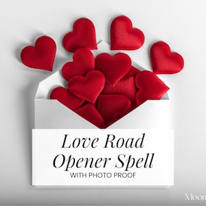 May include: A white envelope overflowing with red heart-shaped objects. The envelope has the text "Love Road Opener Spell" printed on it. The image is on a white background.
